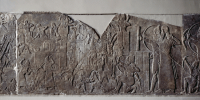 Figure 5. Digital re-colourations of a relief from Ashurnasirpal II’s north-west palace, depicting the king (far right) and the Assyrian army besieging a city; torches are thrown against the invaders, but water is piped from the siege engine to quench the fire (© Li Sou & the Trustees of the British Museum).